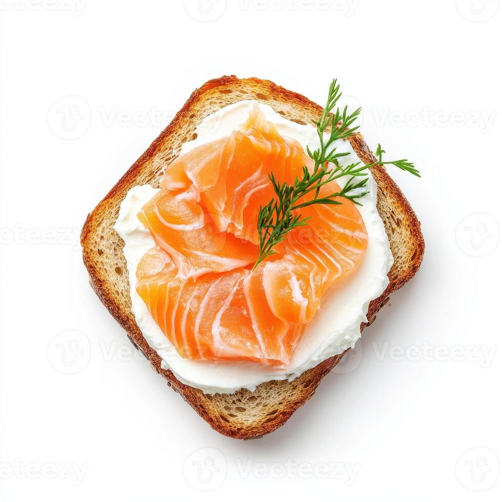 Toasted bread topped with cream cheese and smoked salmon, garnished with dill photo