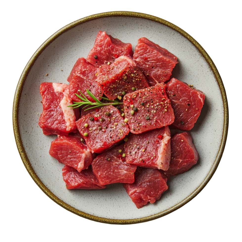 Seasoned raw beef cubes arranged on a plate, ready for preparation in a kitchen setting, seasoned raw beef food on plate isolated on transparent background png