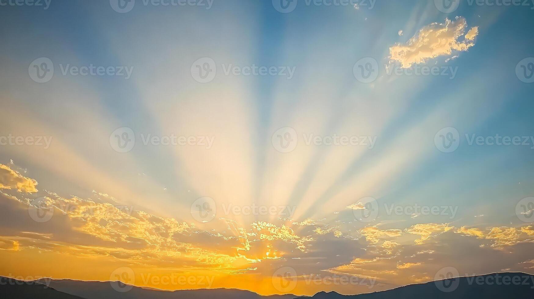 Vibrant sunset with sun rays bursting through clouds over mountains. photo