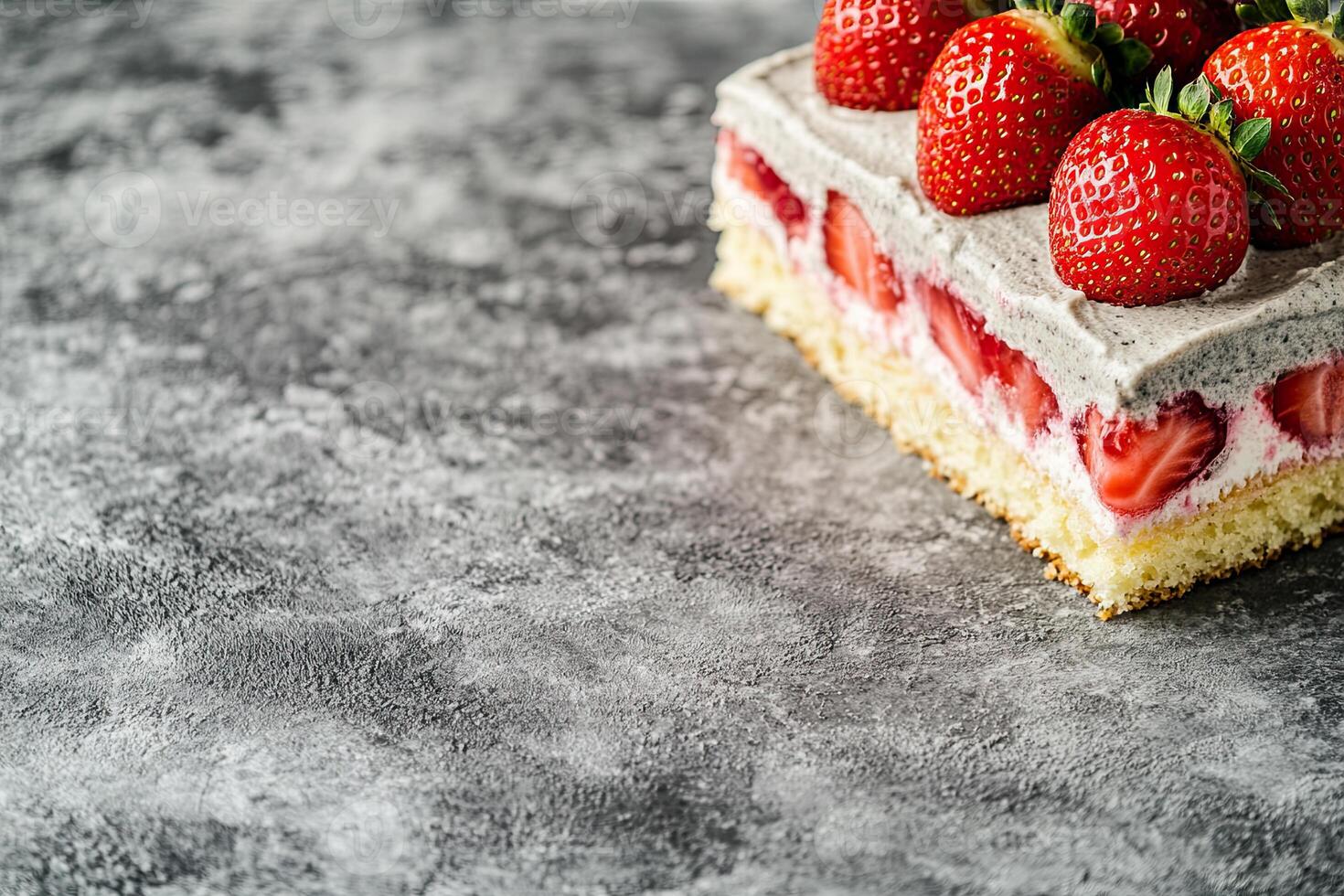 A strawberry cake with cream cheese frosting on top photo