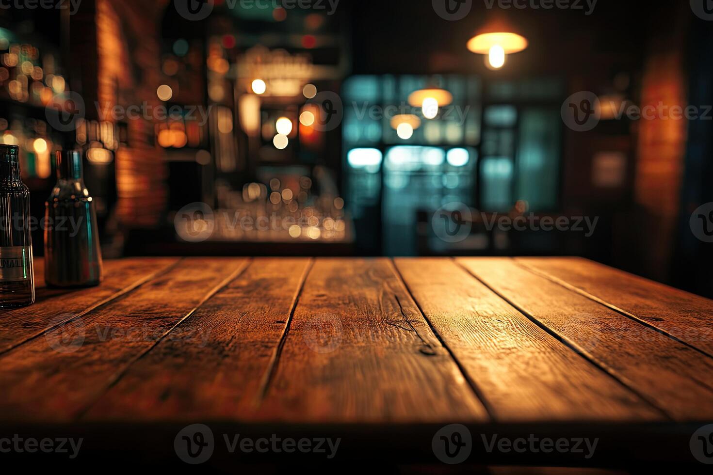 A wooden table with bottles and glasses on it photo