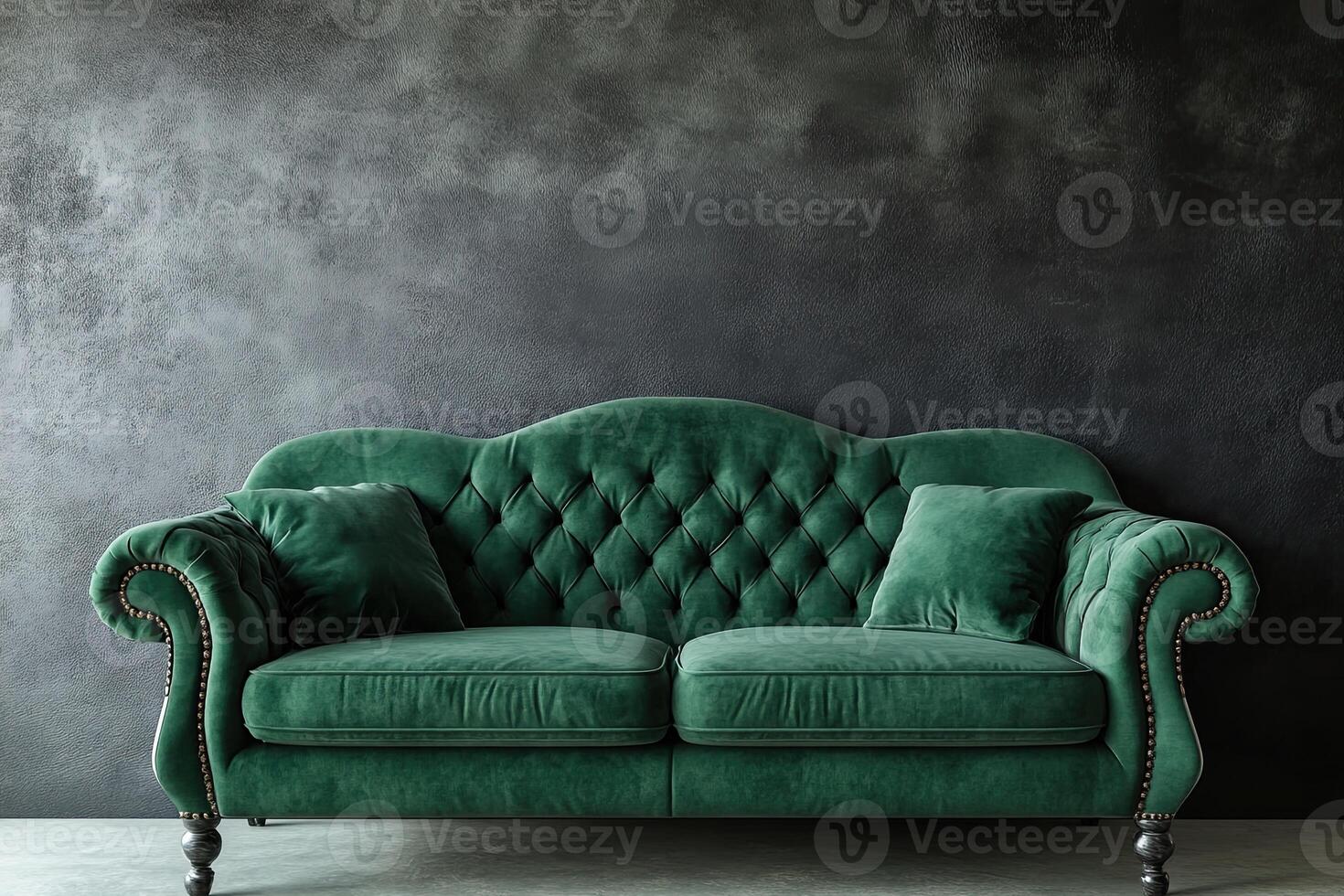 A green couch against a wall photo