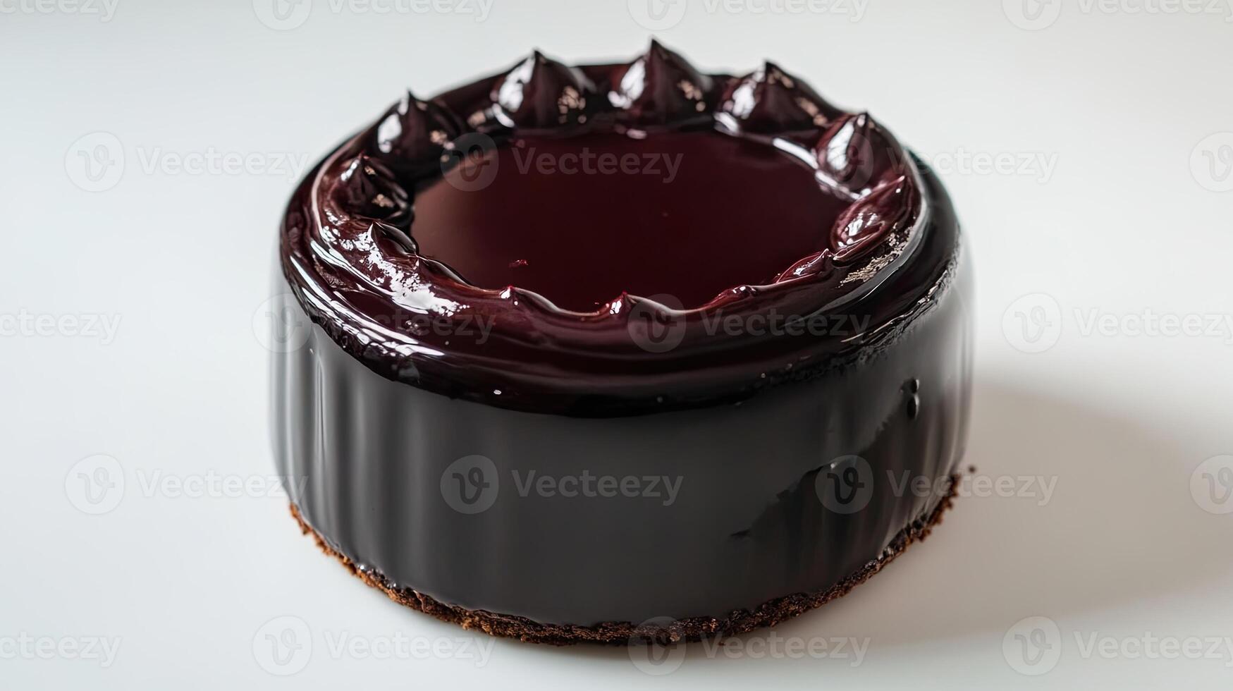 A chocolate cake with a dark chocolate frosting photo