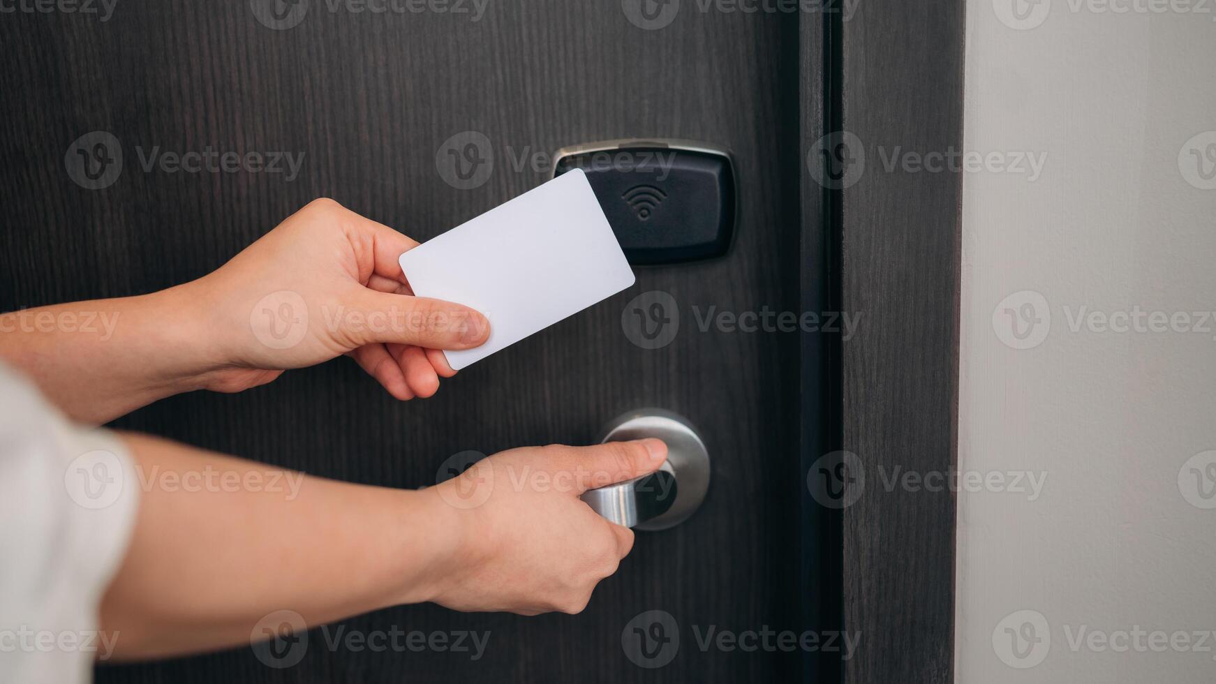 open door in hotel. Smart card key to lock and unlock door. Security systems and protection concept. photo