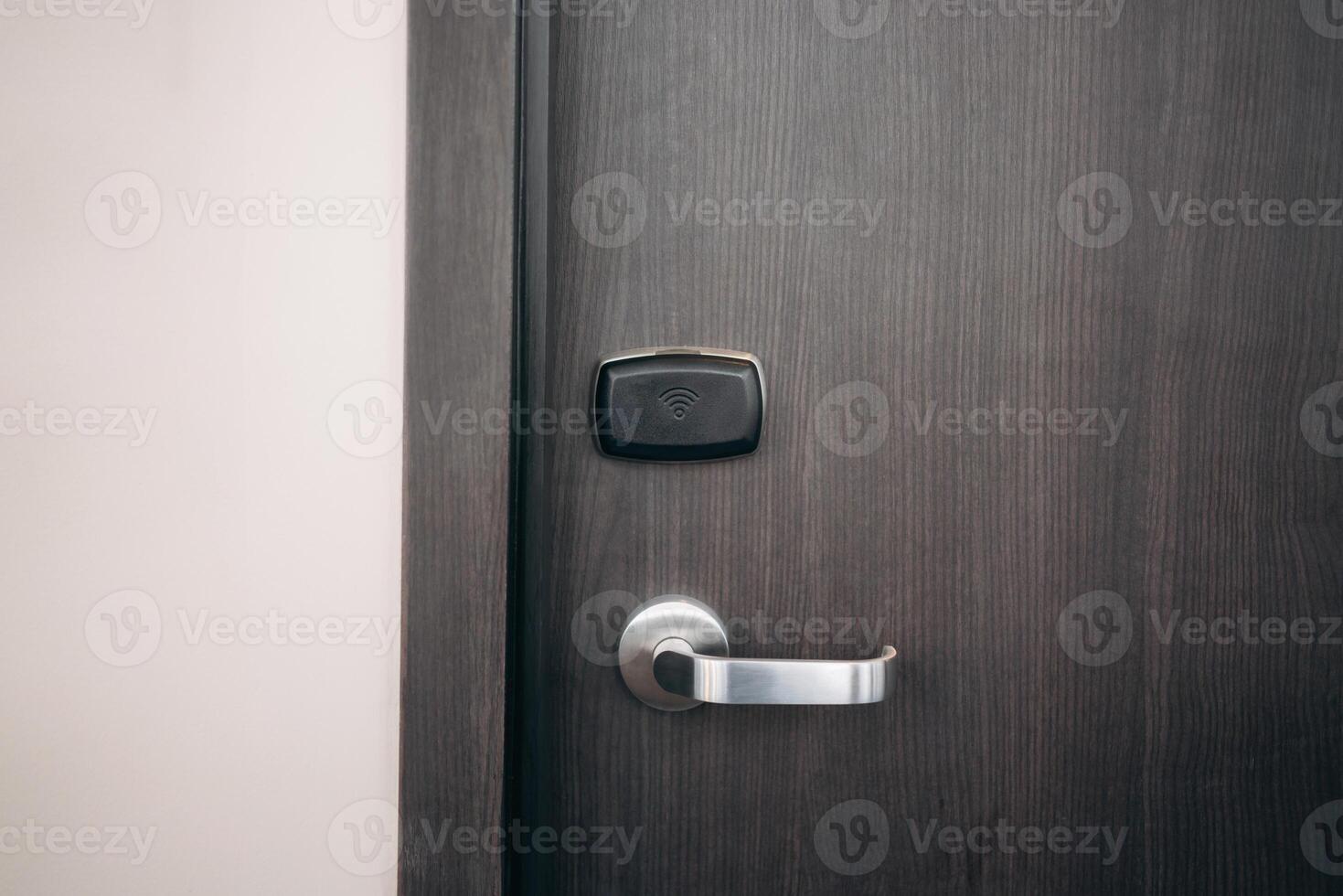 A door with a keypad lock and a silver handle photo