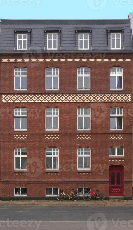 Front view of red row house in Greifswald, Mecklenburg-Vorpommern, Germany. photo