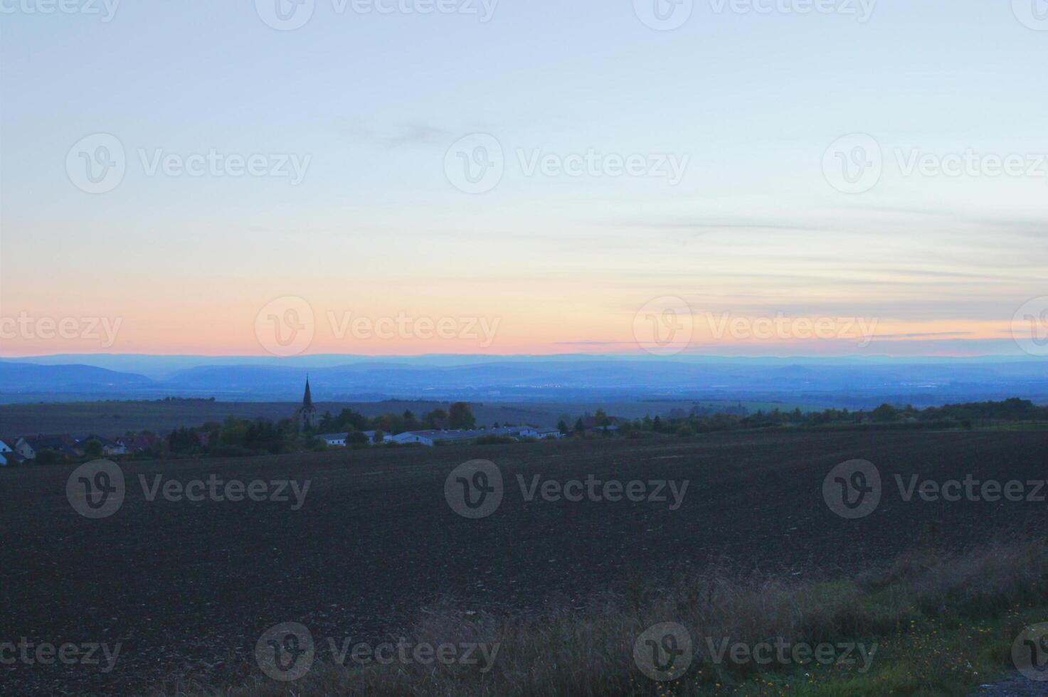 Twilight over a rural landscape in Central Germany Thuringia. Shoot was taken using HDR imaging technique. photo
