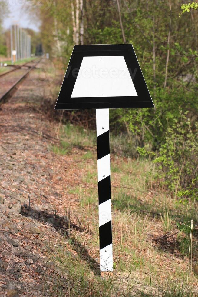 Sign beneath a German railtrack Trapeztafel trapeze panel. photo