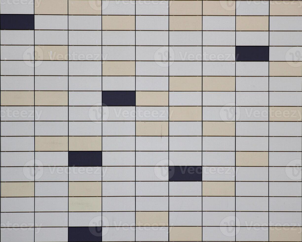 Tiled metalplastic sheet texture with different colors. photo