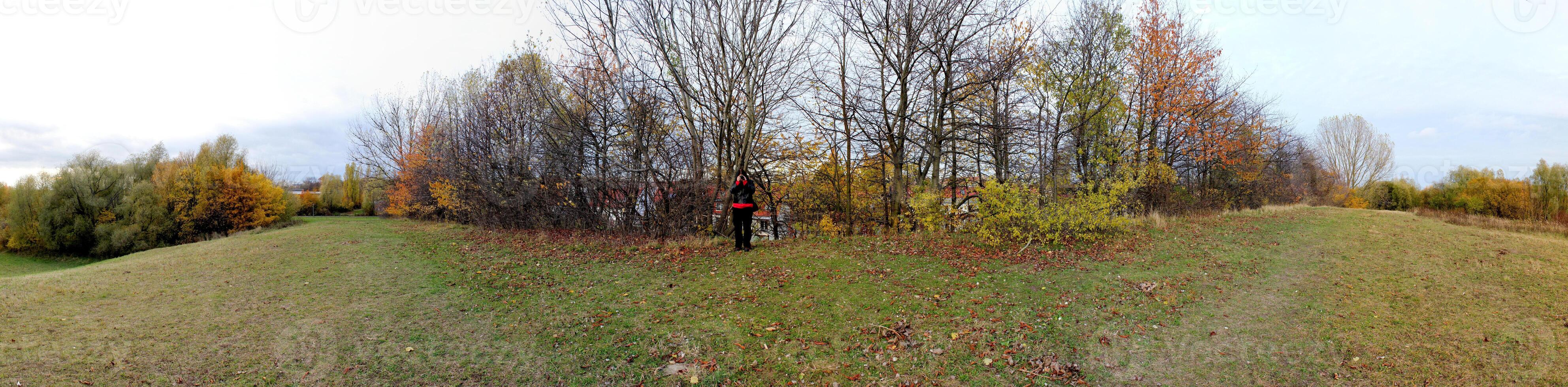 Panoramic view of a photographer on a hill in Greifswald, Mecklenburg-Vorpommern, Germany. photo