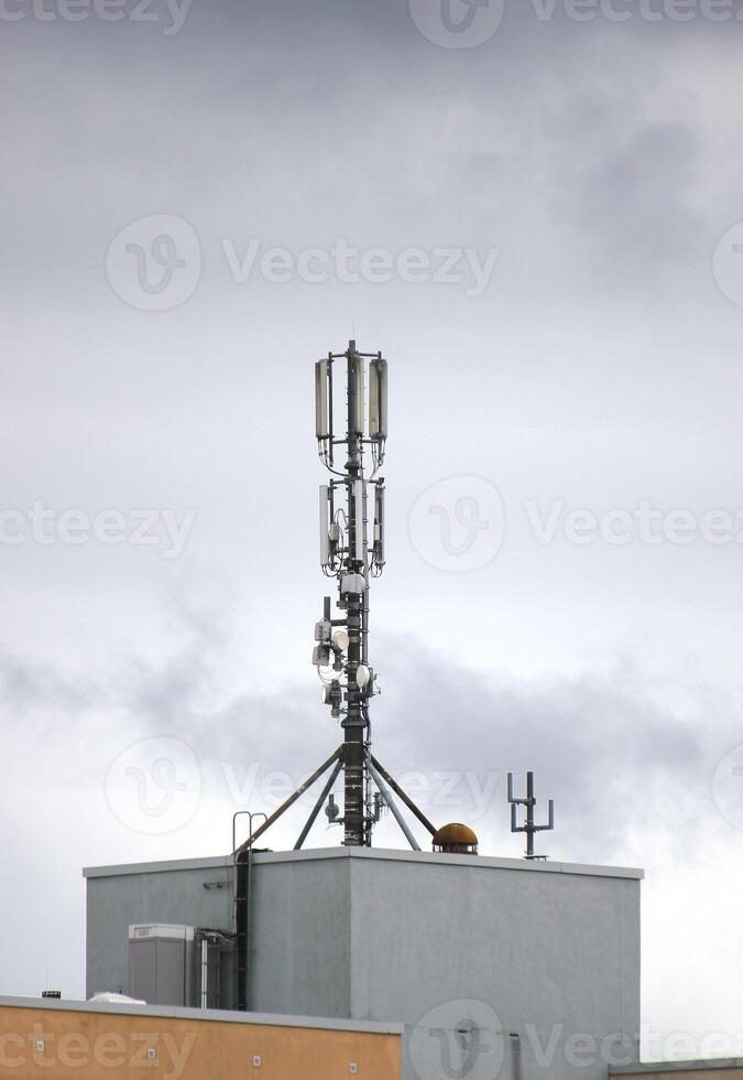 Telecommunications tower on a building. photo