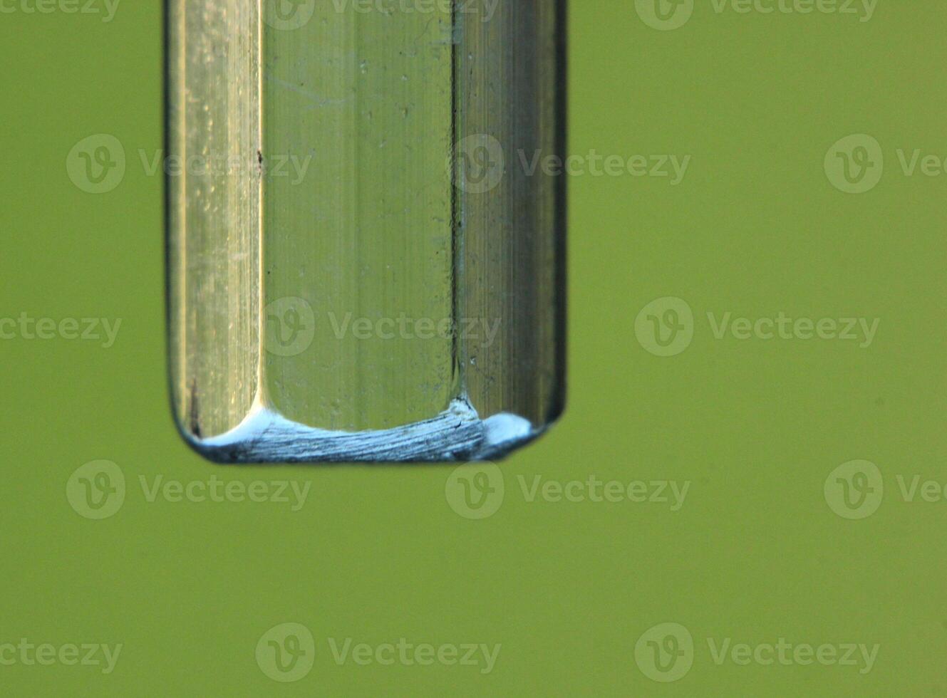 Abstract background from close up of a plastic bar in green light. photo