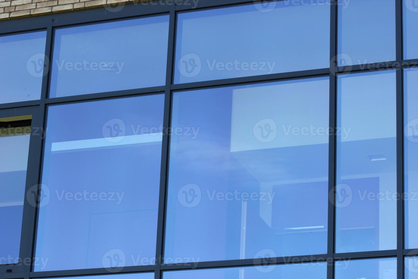 Modern window reflecting blue sky. photo