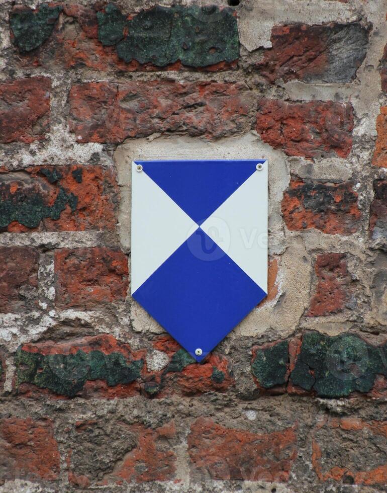 Sign indicating a building protected as cultural heritage in Germany. photo