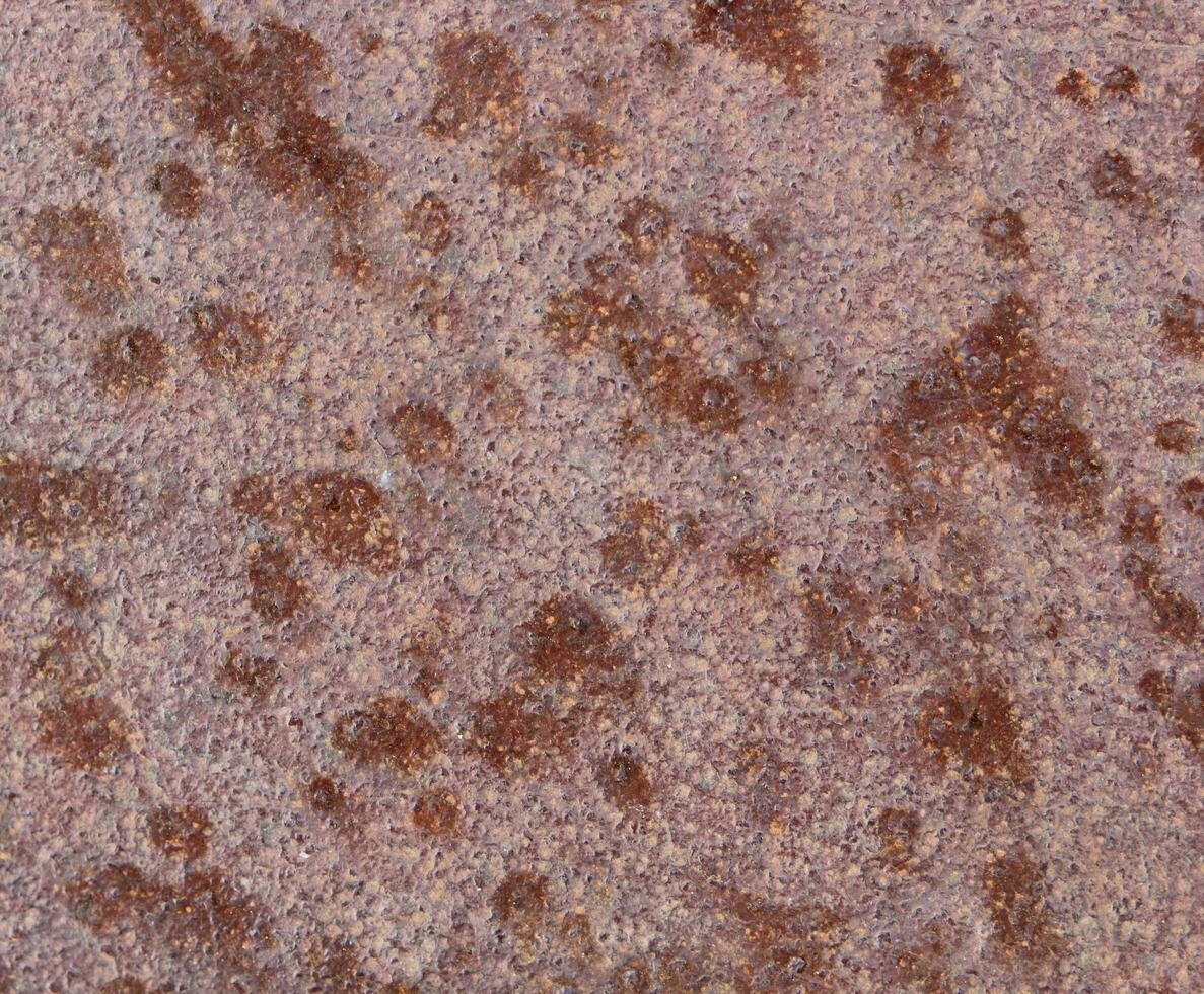 Macro of metal surface with rust speckles. photo