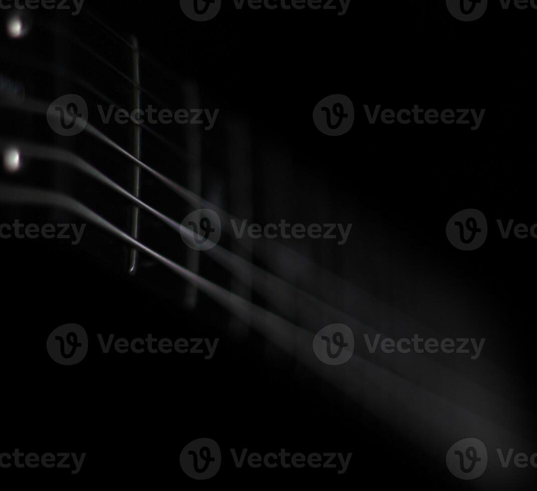 Conceptual lowkey shot of guitar strings photo