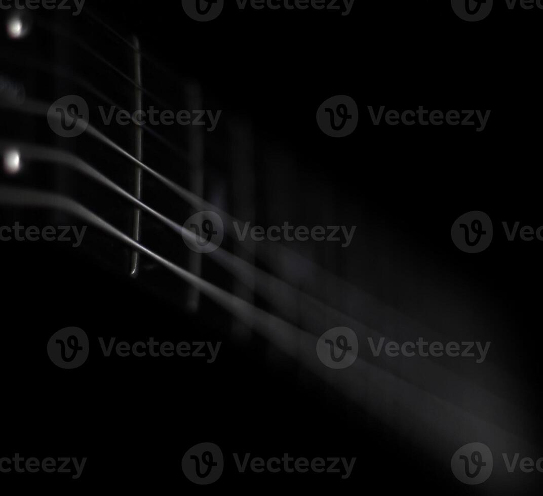 Conceptual low key shot of guitar strings photo