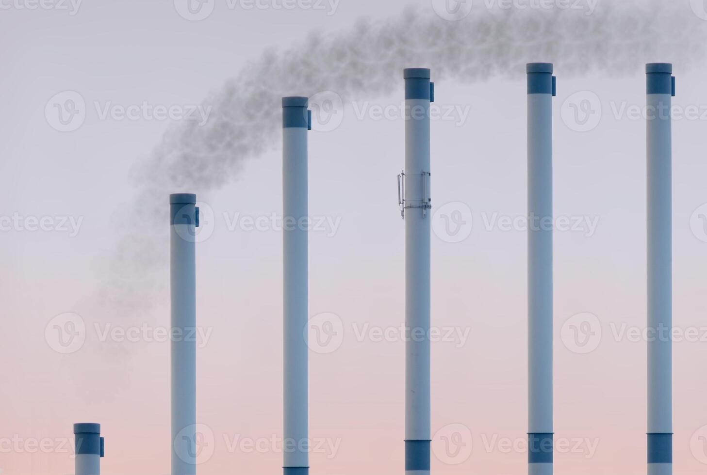 Smoke pipes in ascending row showing saturation curve with smoke added at the top. photo