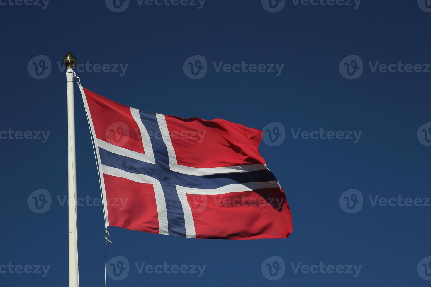 Flag of Norway on dark blue sky. photo