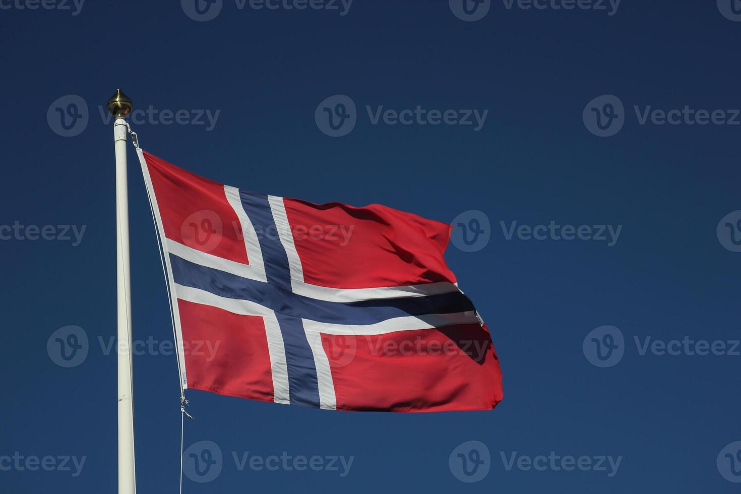 Flag of Norway on dark blue sky photo