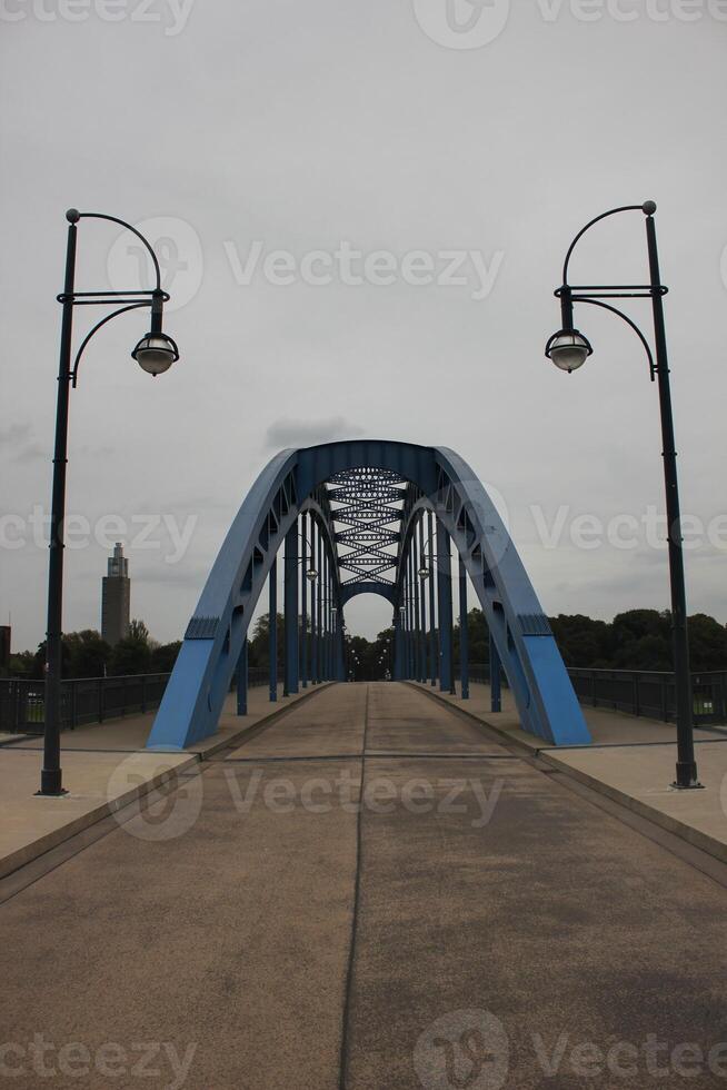 View to the Sternbruecke lit star bridge in Magdeburg, capitol of Saxony-Anhalt, Germany photo