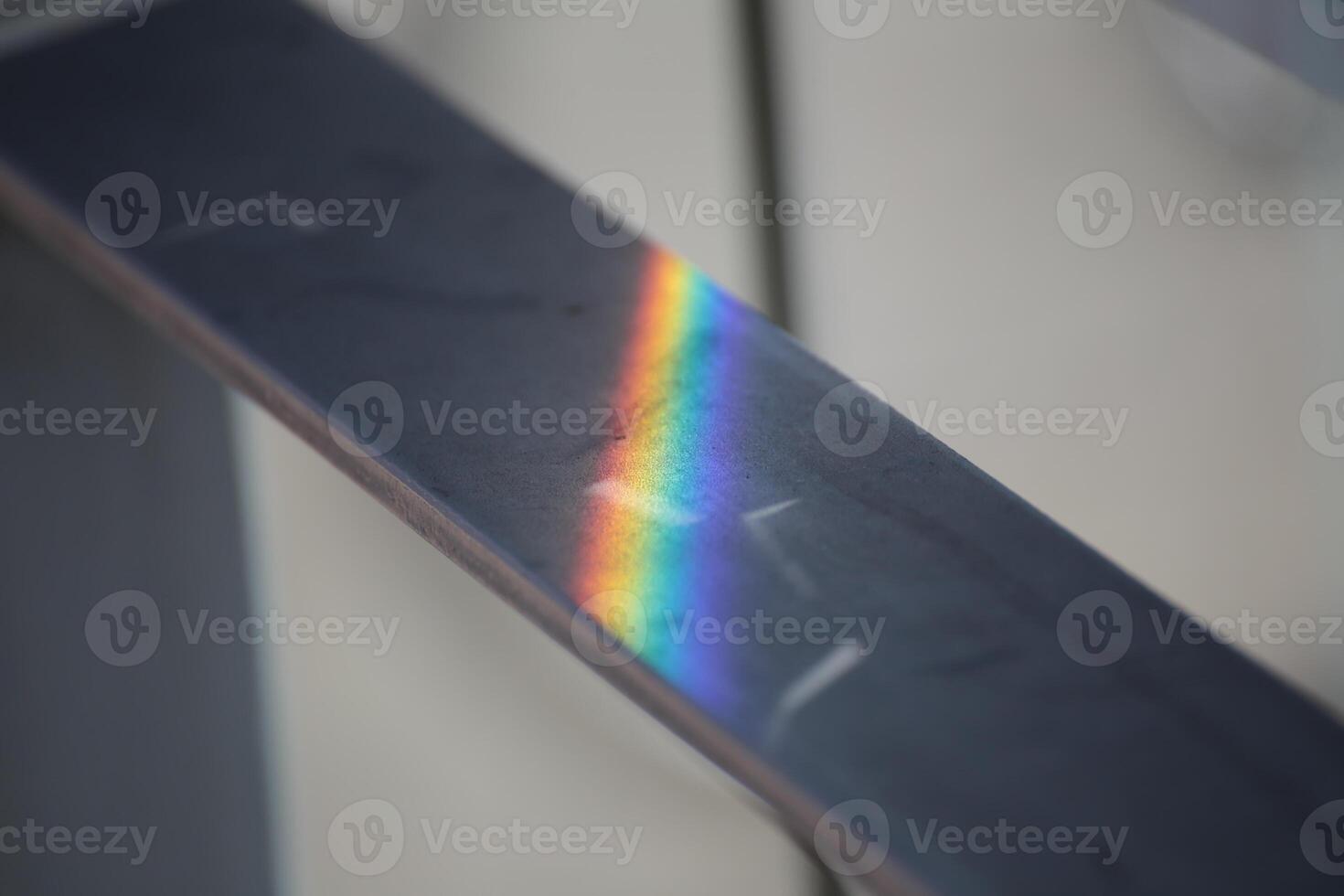 Iridescent reflection on a metal rail. photo