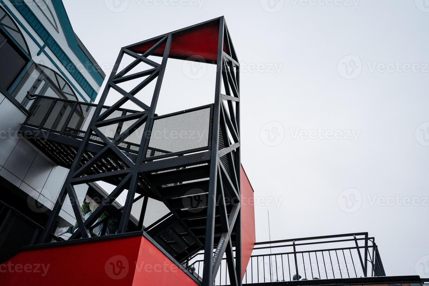 A fire escape is an essential safety feature that is constructed into a building, providing occupants with a quick and safe means of exiting during emergency situations or crises photo