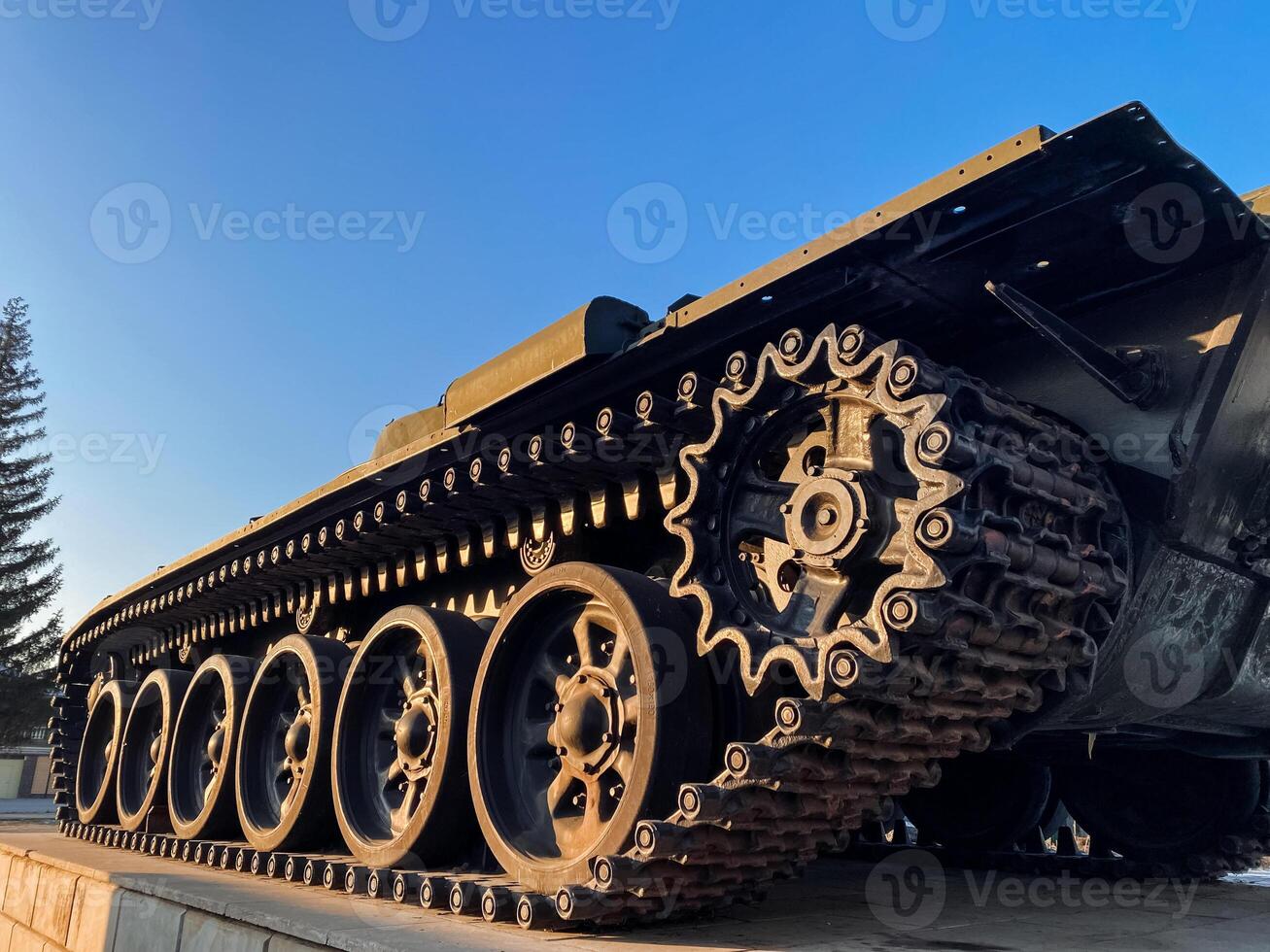 A tank equipped with numerous gears positioned on it, showcasing the intricate engineering involved in its design and functionality, thereby enhancing its overall performance photo