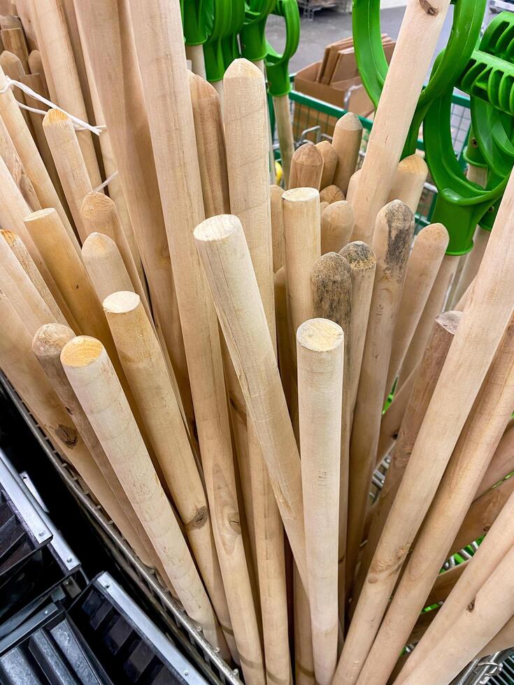 A large assortment of various wooden sticks has been meticulously arranged and stacked on top of one another, resulting in a robust and wellorganized pile consisting of natural materials photo