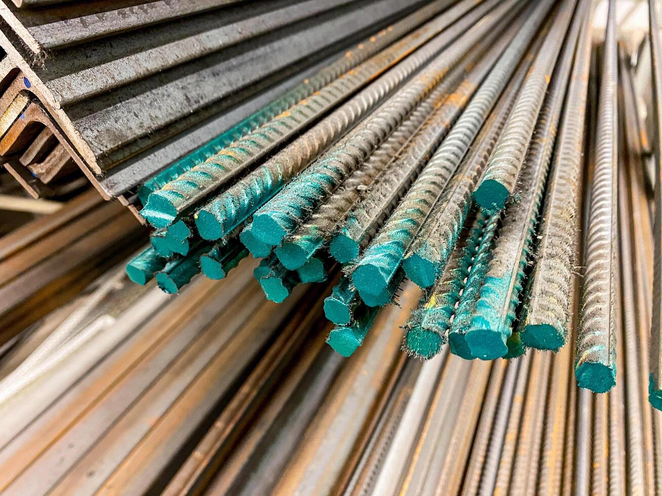 A considerable number of steel bars are meticulously stacked on top of one another, creating a structured arrangement that is often used in construction and engineering projects photo