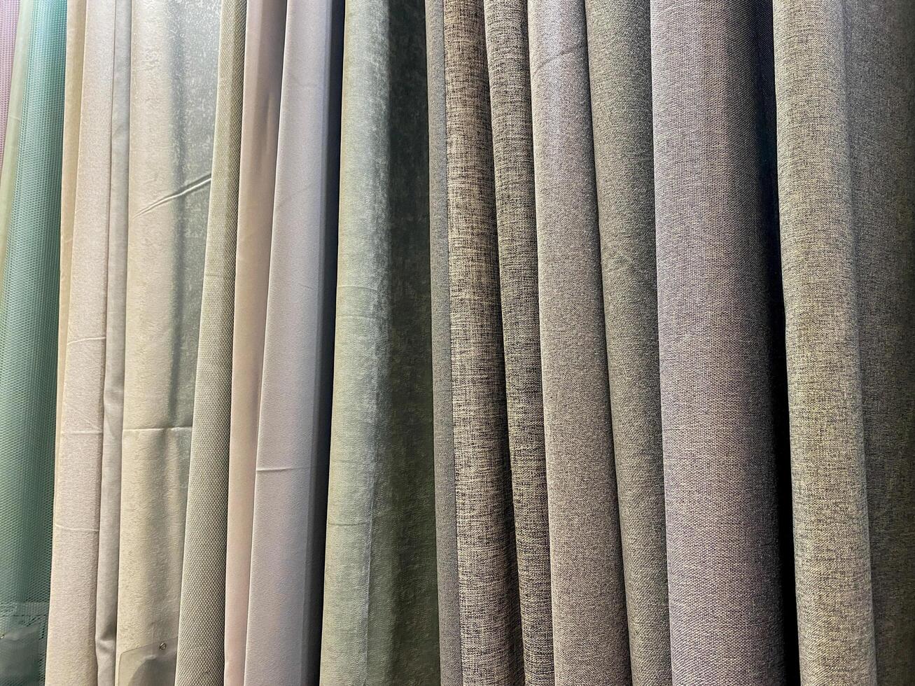 The elegantly displayed curtains on show effectively showcase a wide variety of unique textures coupled with vibrant colors, which capture the attention of potential customers effortlessly photo