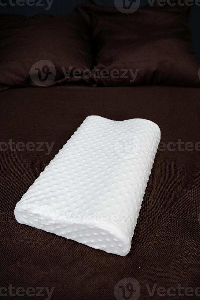 Soft pillow for correction of the back during sleep, orthopedic product made of parolon, photo