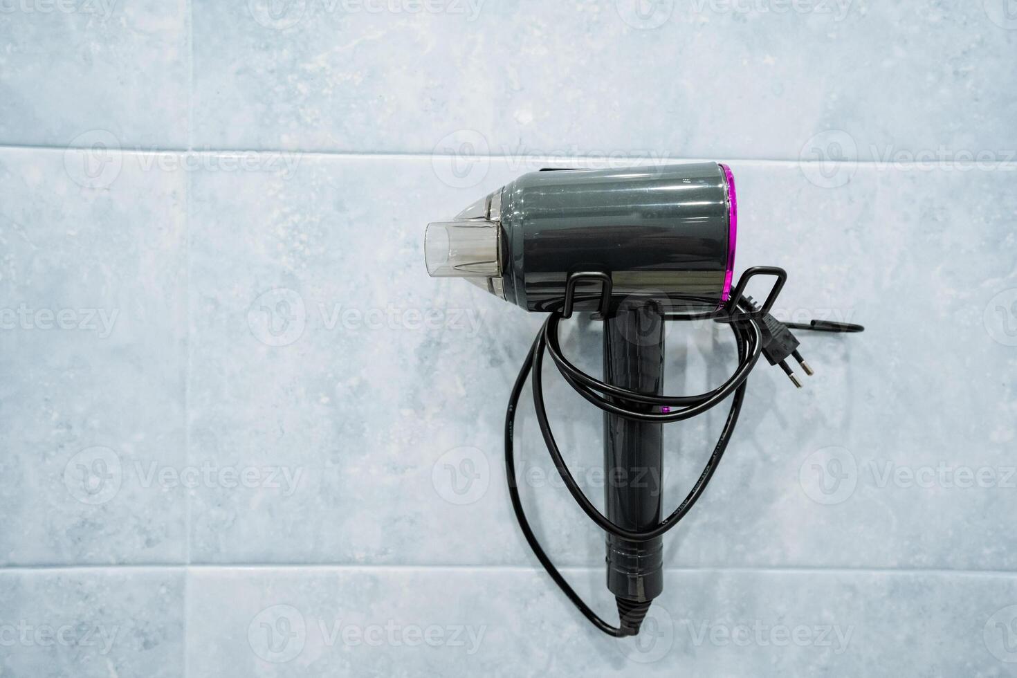 This Compact Hair Dryer features a stylish Black and Pink Design, making it an ideal choice for both home use and travel, ensuring you have perfect hair wherever you go photo