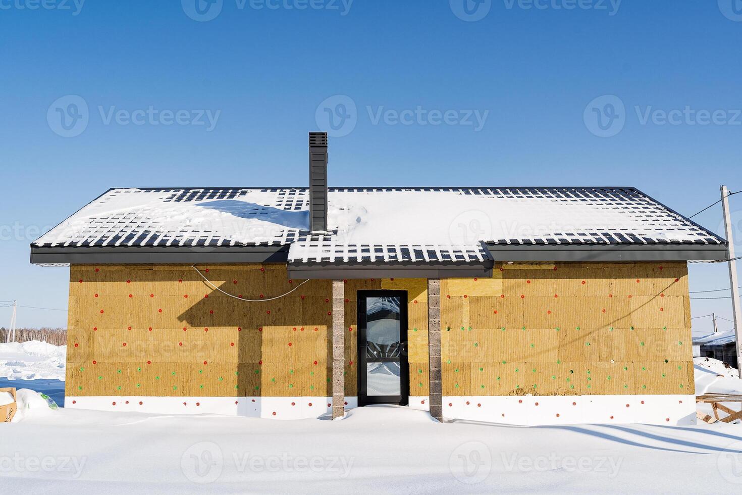 Construction of a country house, insulation of walls with mineral wool, warm facade of the building. photo