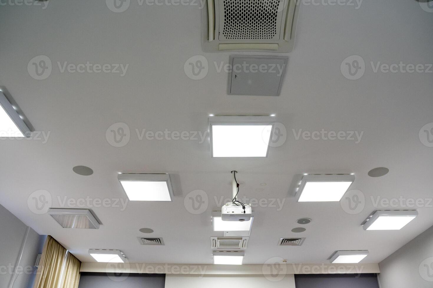 A Modern Office featuring a stylish Ceiling equipped with advanced Lighting and Air Conditioning Systems for ultimate comfort and ambiance photo