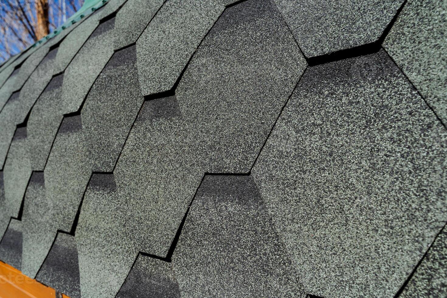 This image provides a detailed closeup view of a roof that has shingles installed on it, showcasing the textures and materials used in roofing designs and constructions photo