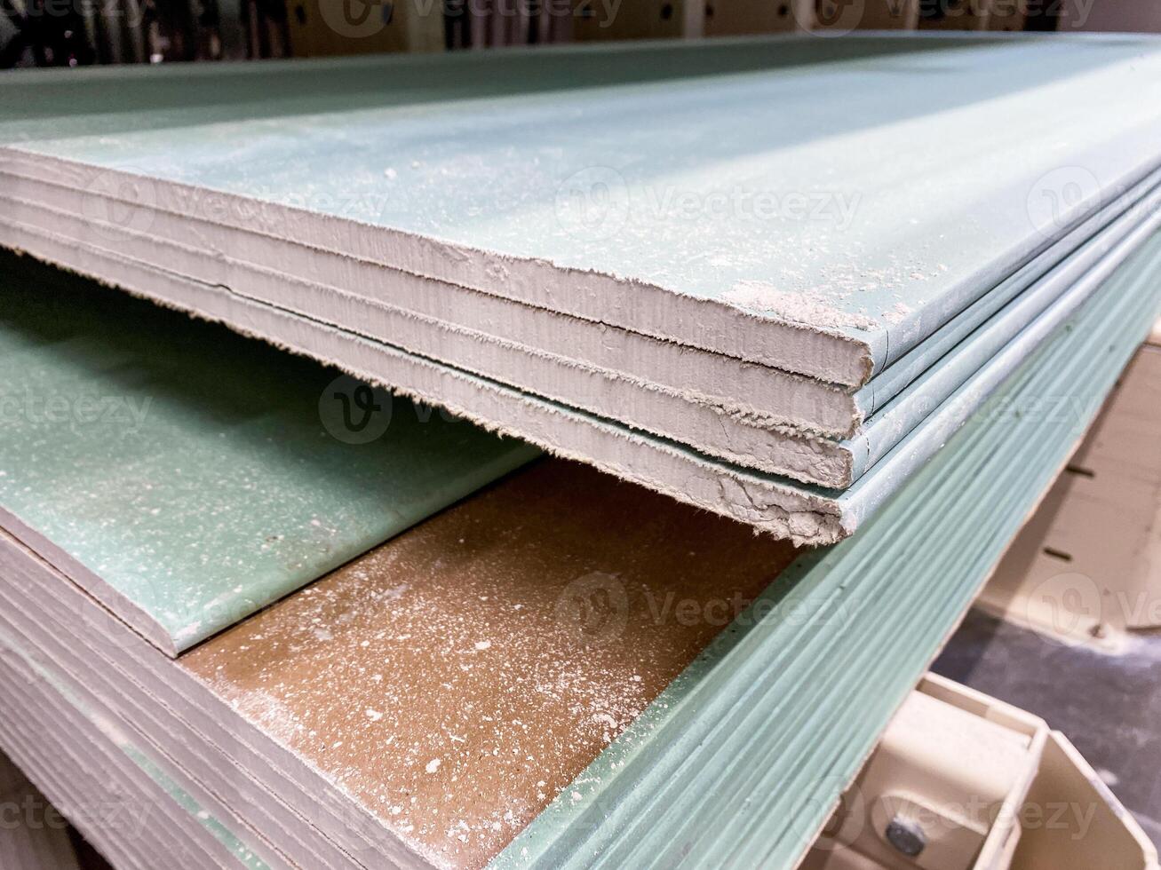 A stack of Green Gypsum Boards is fully prepared and ready for use in construction projects, providing essential features for quality building applications photo