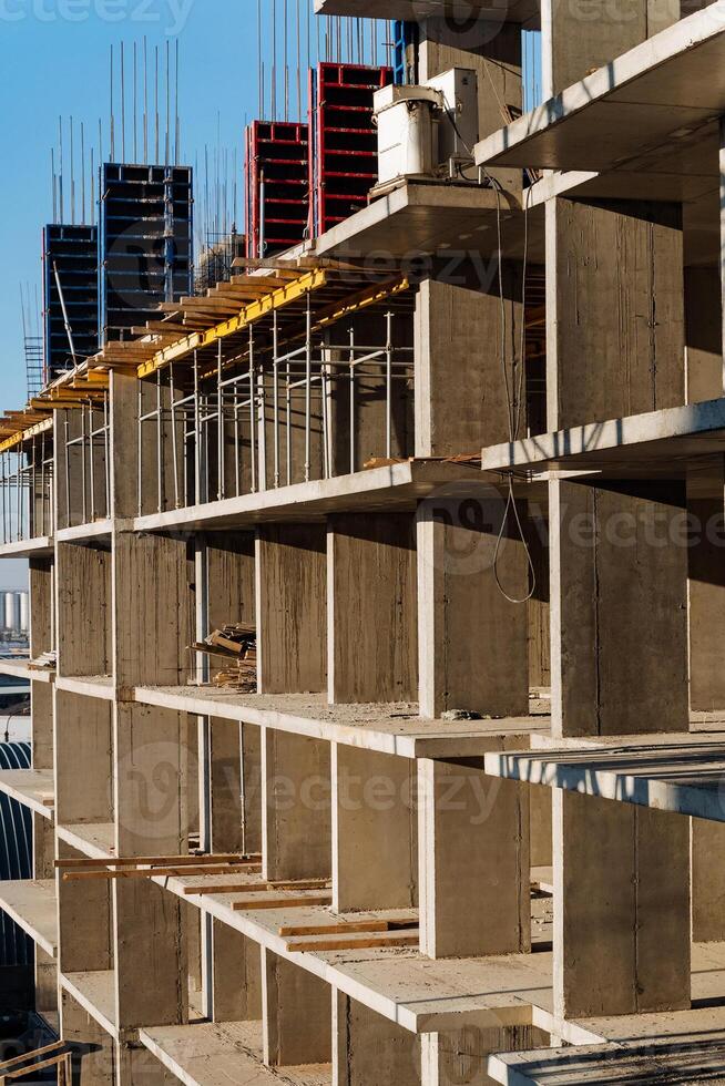 A large building that is currently under construction, showcasing a multitude of shelves being installed and utilized throughout the space, reflecting its developing status photo