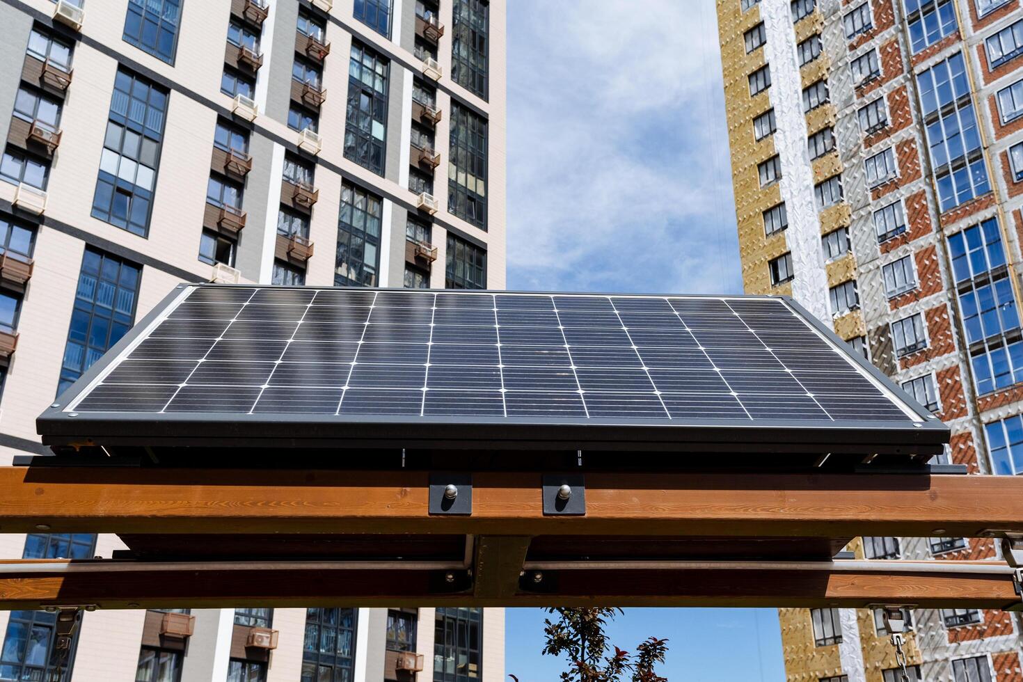 In a modern cityscape, photovoltaic solar panels support sustainability by harnessing renewable energy under the clear sky, helping to enhance urban sustainability photo