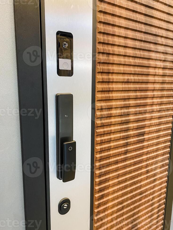 The image showcases a closeup of a beautifully designed door with a thoughtfully installed doorbell, highlighting the unique features of this often overlooked entryway accessory photo