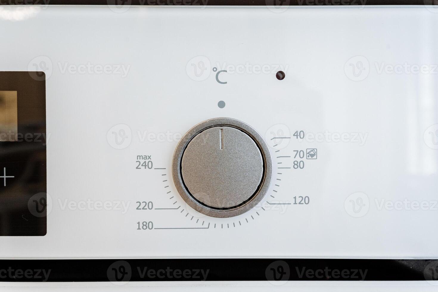 A detailed image of a modern ovens temperature control knob is ideal for enhancing efficiency in household baking and cooking in the kitchen, catering to culinary enthusiasts photo