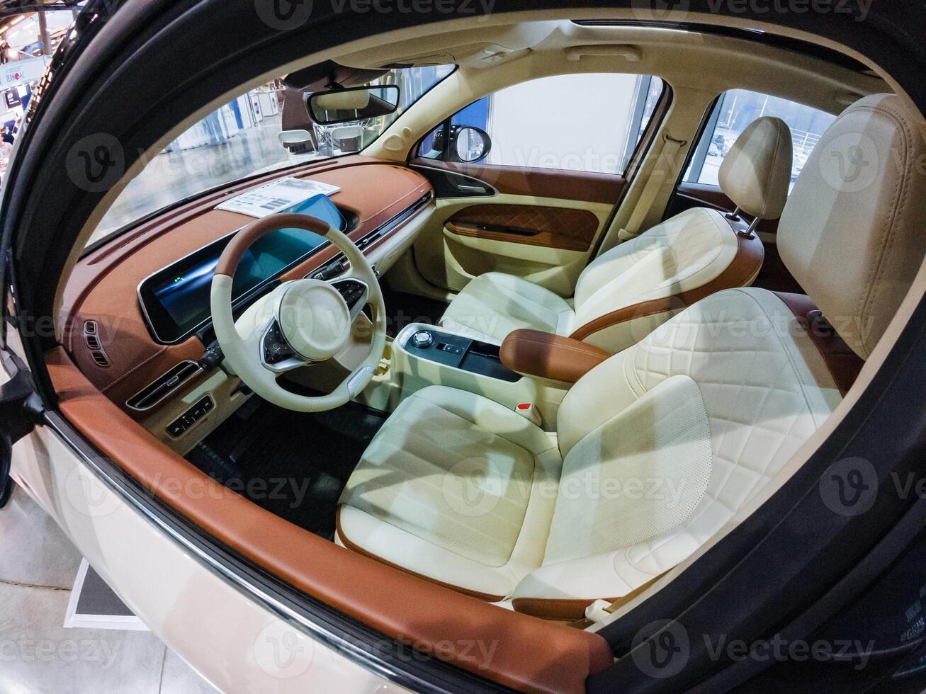 Inside a car, you will find essential features such as the steering wheel, various comfortable seats, and other components that contribute to the overall vehicle experience photo