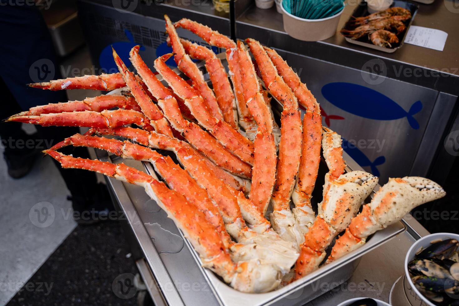 Freshly Cooked and Delicious King Crab Legs Beautifully Displayed at a Bustling Seafood Market Today photo