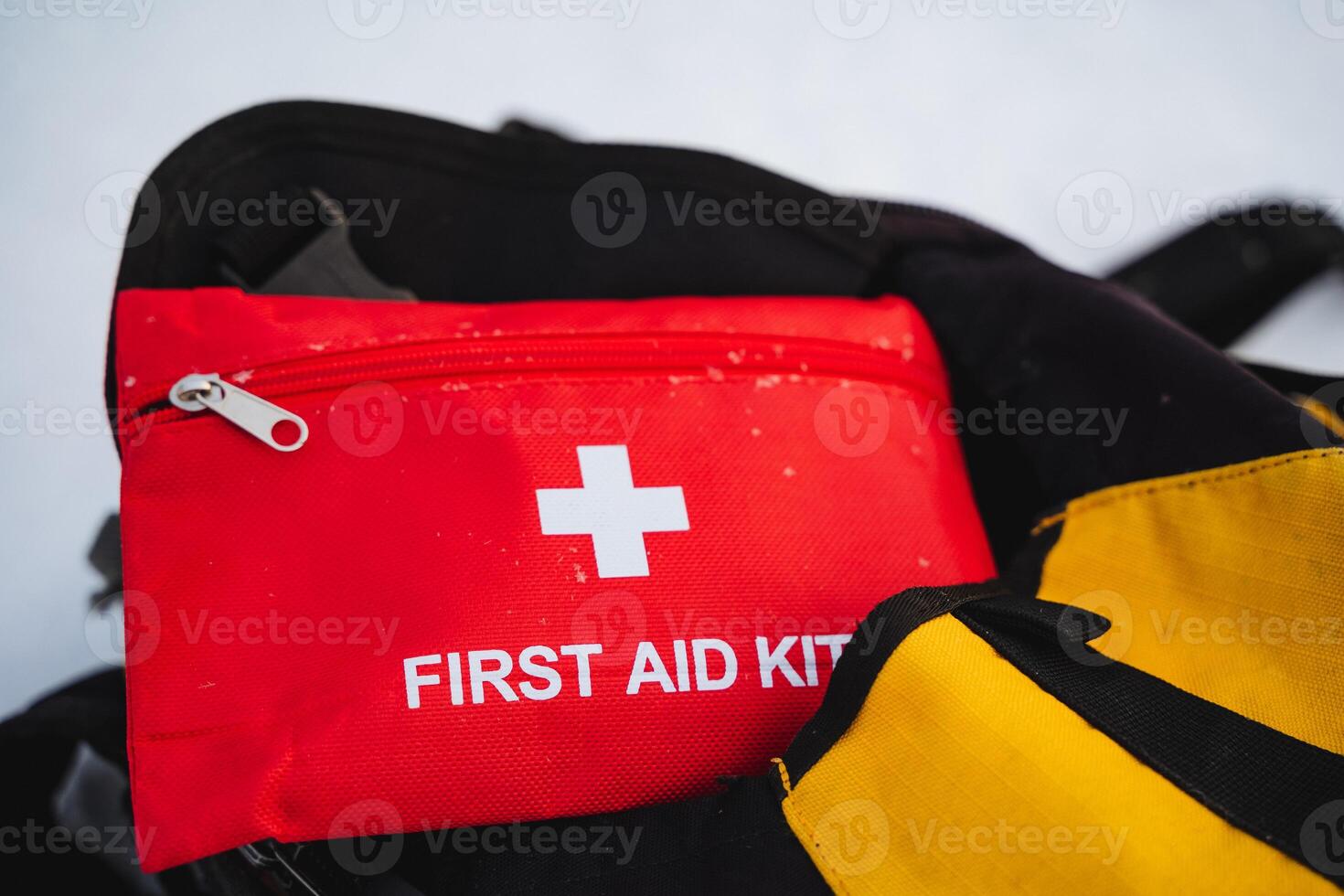 A vibrant red first aid kit that prominently showcases a distinct white cross symbol on its surface, ensuring easy identification and quick accessibility during emergencies when needed photo