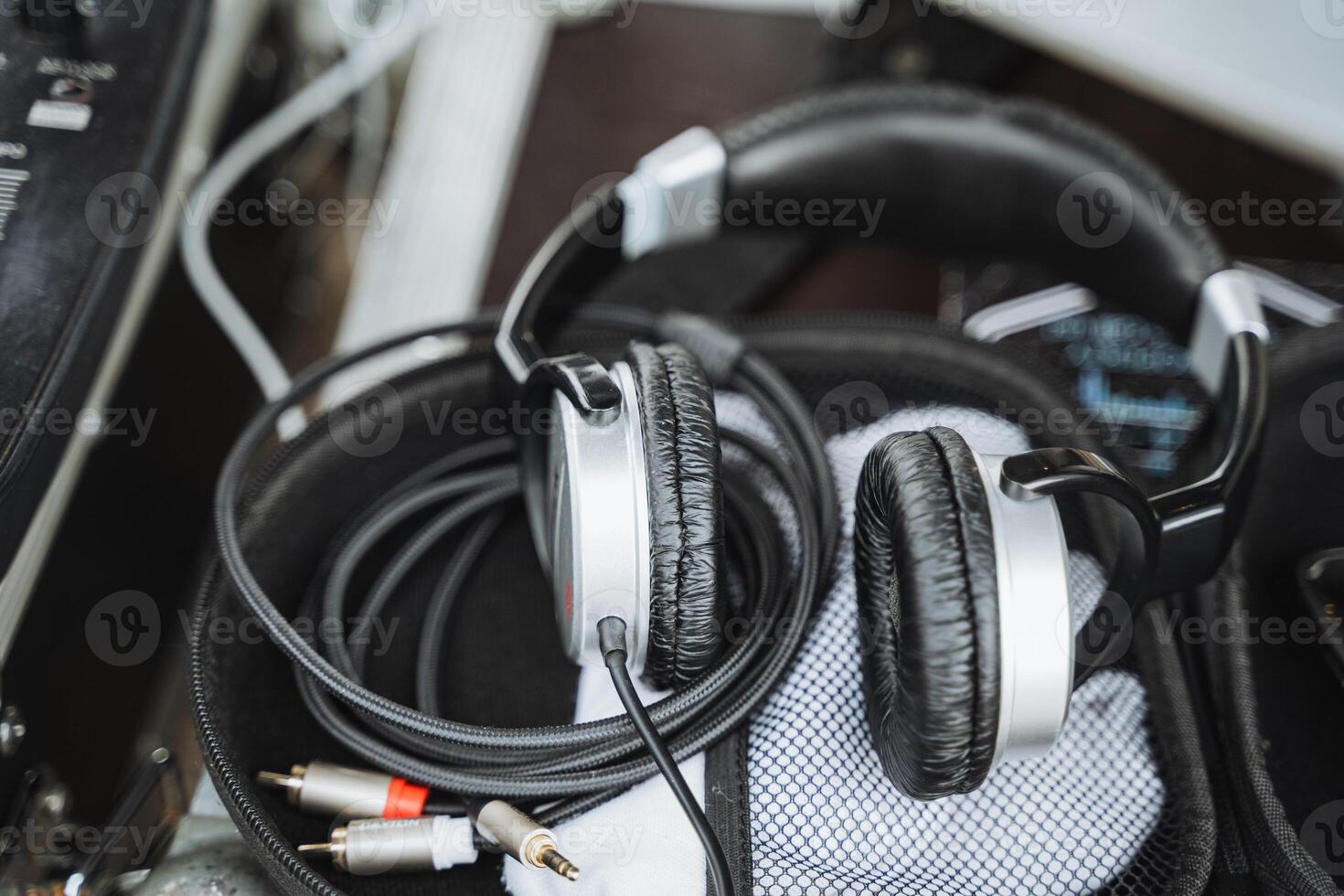 HighQuality Professional Headphones Set Up in a Music Environment, Complete with Necessary Cables and Various Accessories Included photo