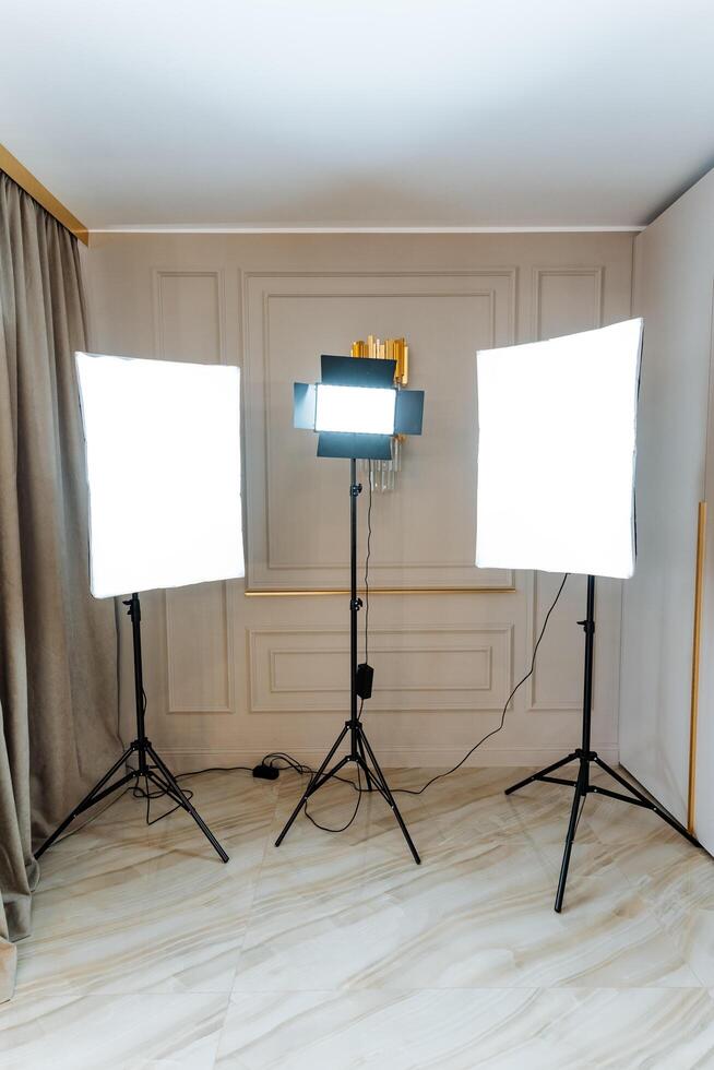 Three lights illuminate the room, casting a warm glow photo