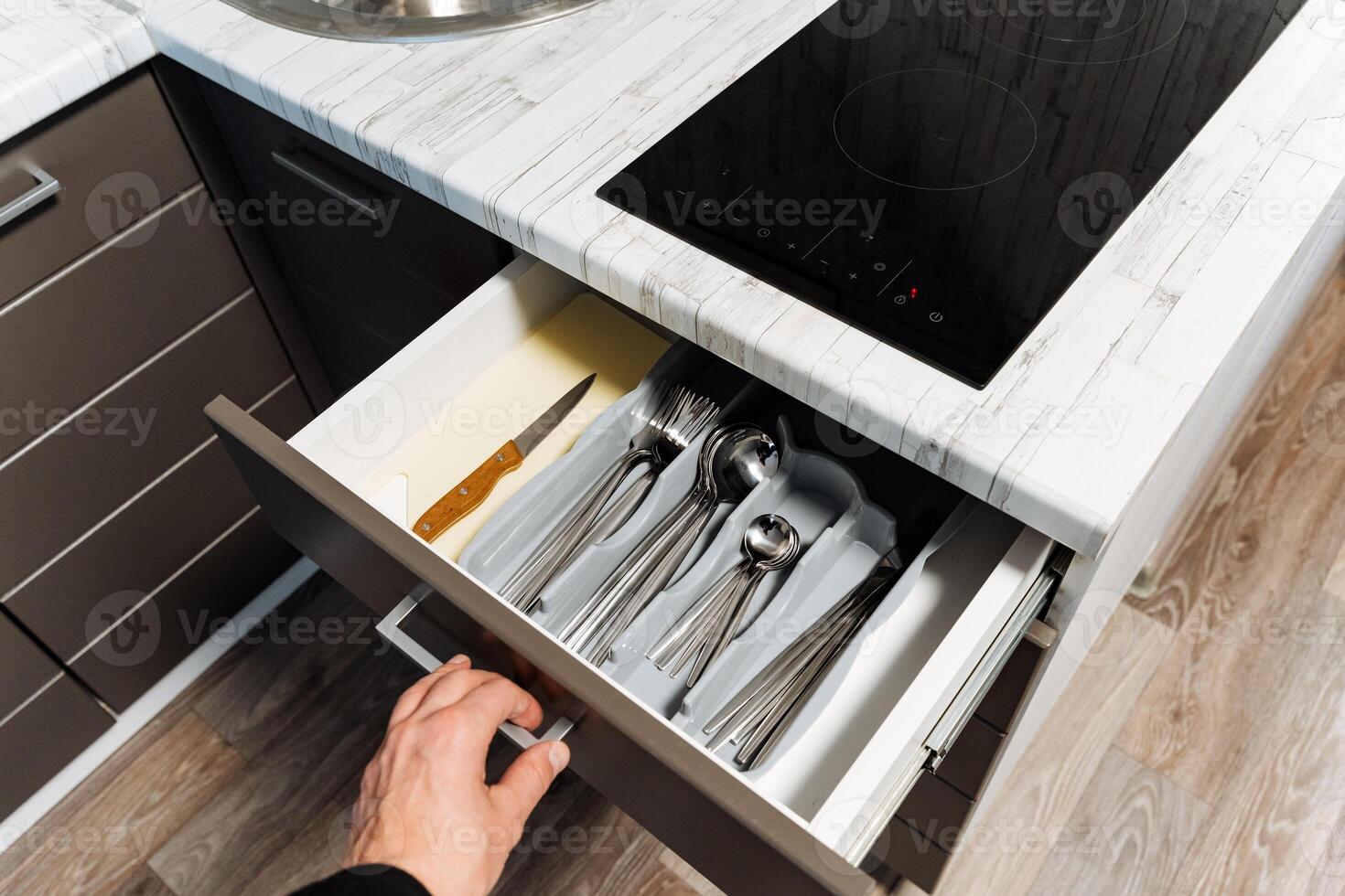 Discover the art of modern kitchen drawer organization featuring neatly arranged cutlery and utensils to enhance functionality for your cooking and dining experience photo