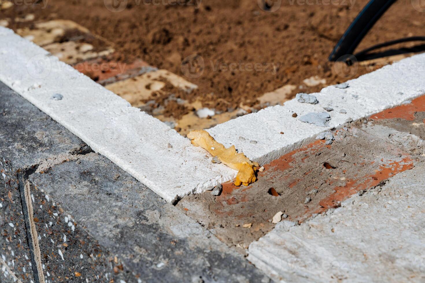 A closeup view of a concrete surface with a clear white line, ideal for roads or sidewalks. Emphasizing keywords like road surface, wood, asphalt, brickwork, and building material photo