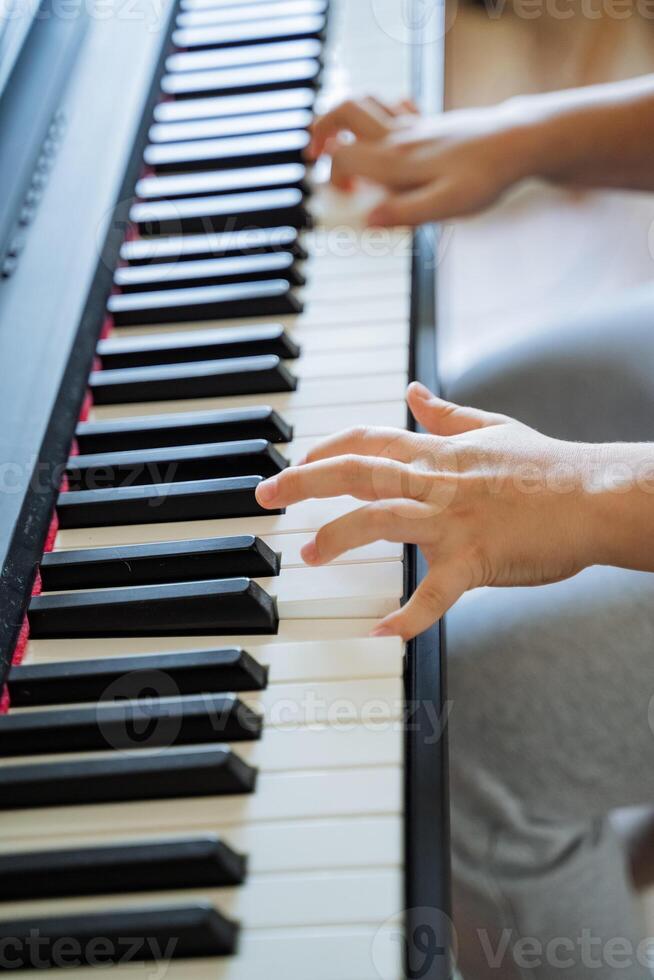The Hands of a Child Engaged in Playing the Piano A Captivating Moment Marking Musical Discovery, Joy, and Individual Enjoyment Through Artistic Expression and Exploration photo