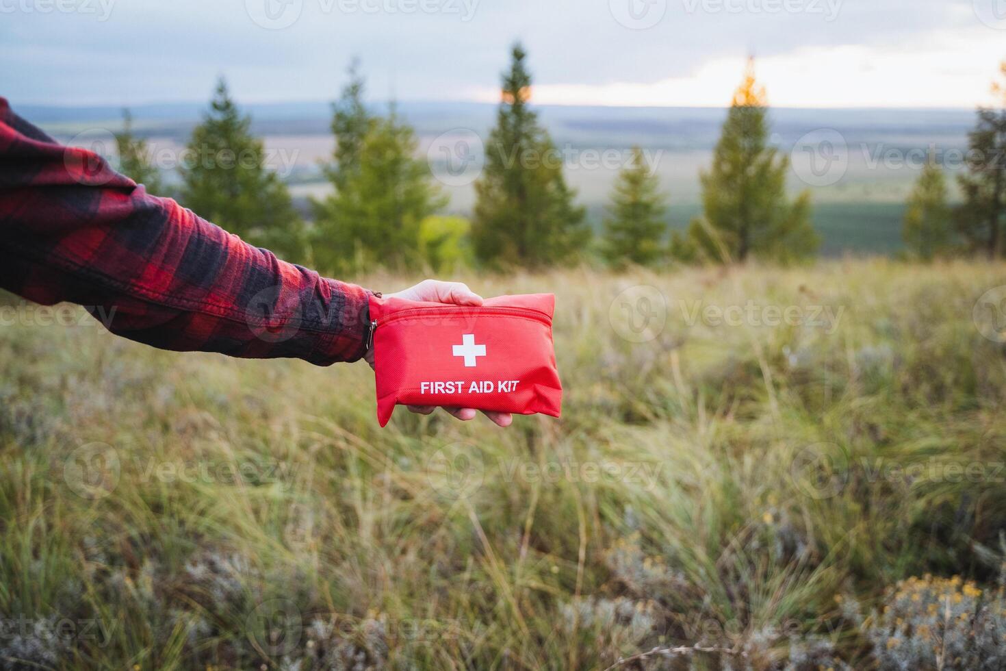 Embarking on an Outdoor Adventure Essential First Aid Kit Set Against a Scenic Landscape Perfect for Your Next Exploratory Journey photo